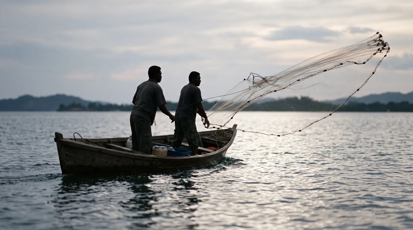 Two fishermen casting a wide net from a wooden boat at sunrise — Fishers of Men, sales process design and training